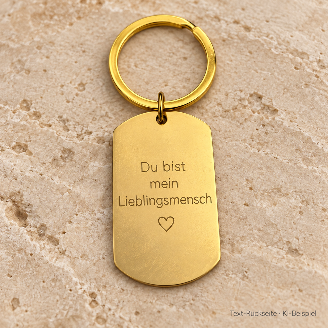 KI-Beispiel für die Text-Rückseite der Option Foto vorne + Text hinten: goldfarbener Edelstahl-Dogtag mit Du bist mein Lieblingsmensch und Herzsymbol